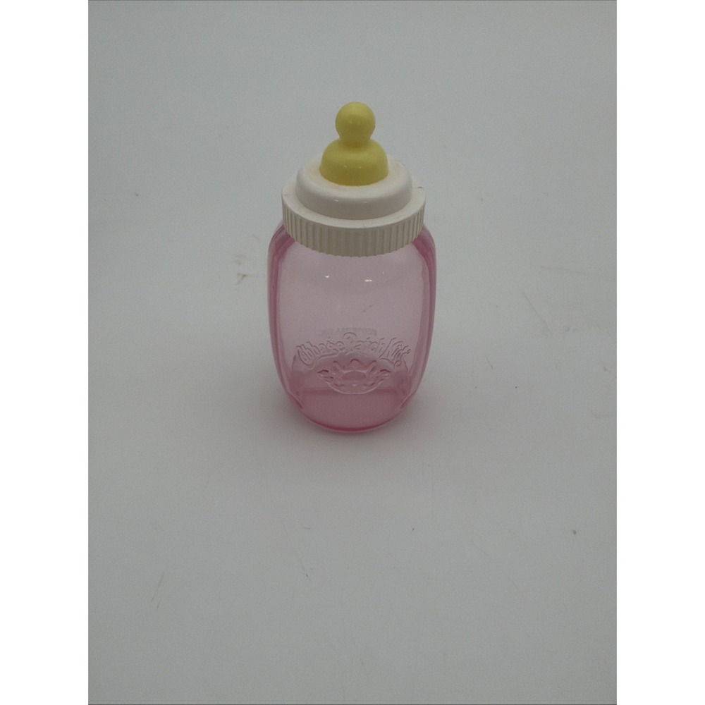 vintage Cabbage Patch Kids doll baby bottle with a pink translucent body